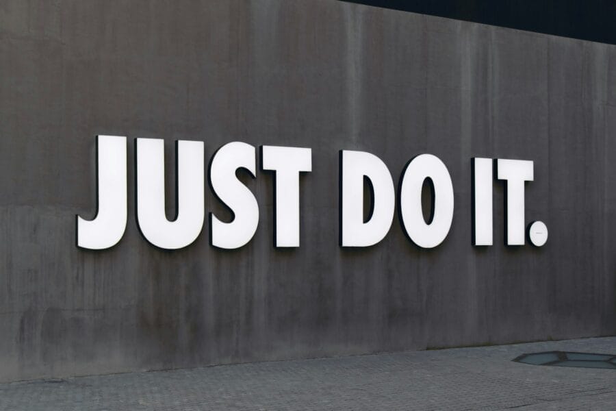 white Just Do It. wall sign